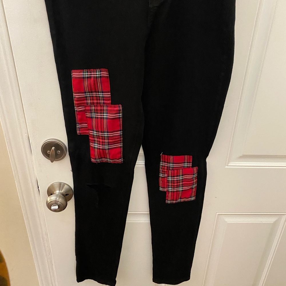 Black pants with red patches